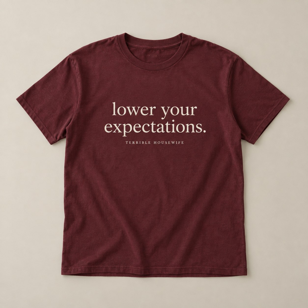 Lower Your Expectations Tee in Burgundy — concept mockup